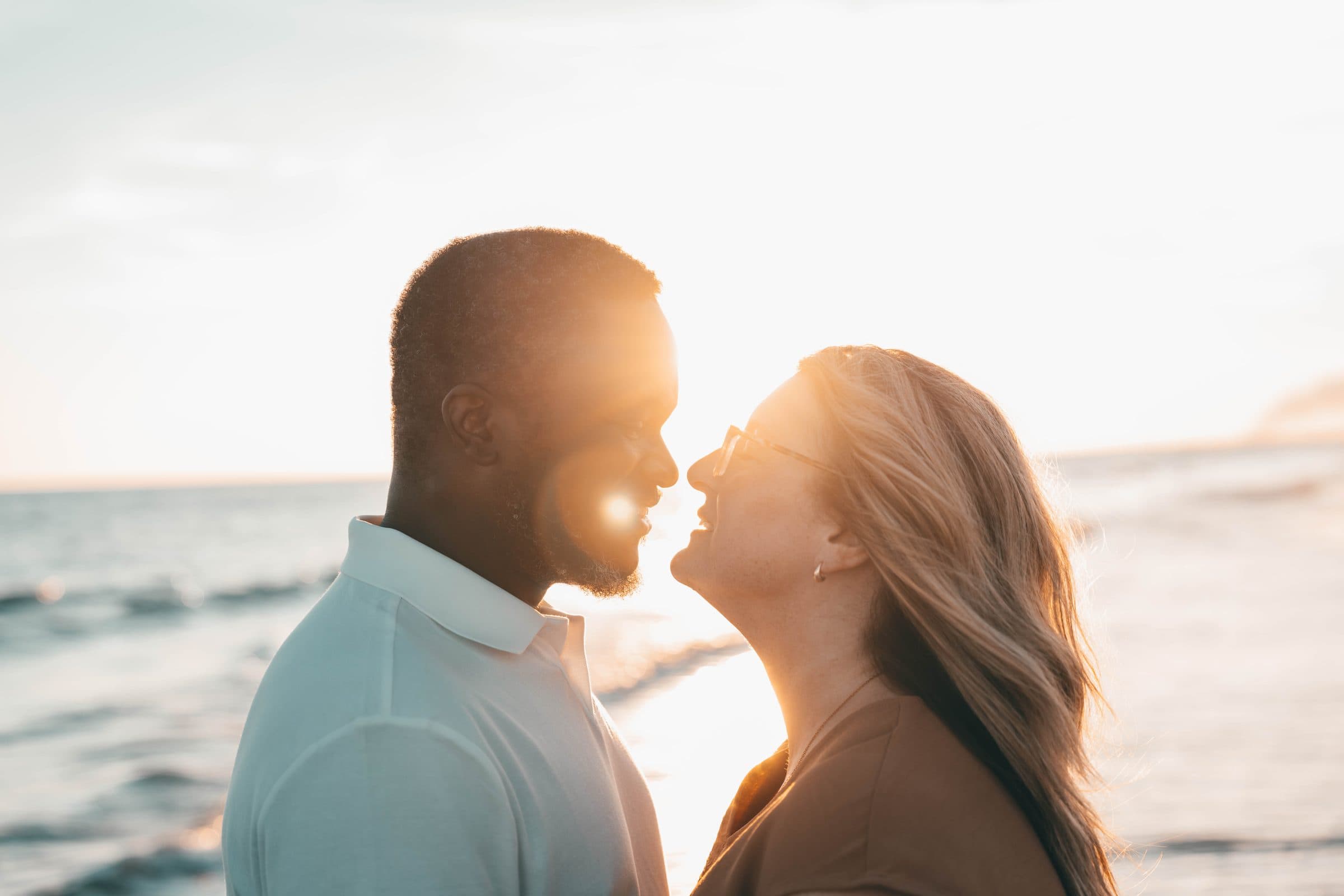 Couple nose to nose in golden sunset light